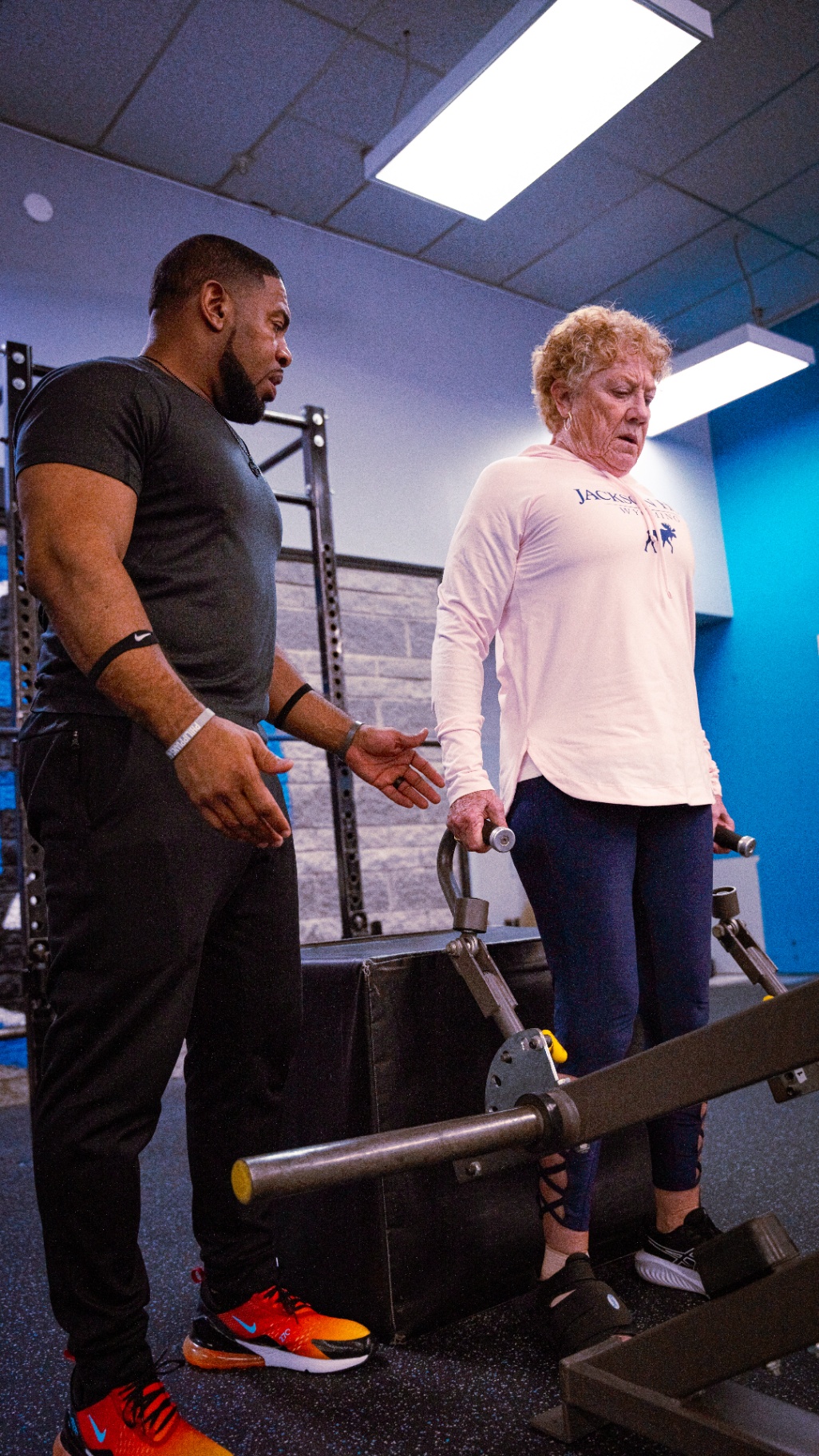 Personal trainer coaching a client
